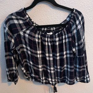 Slightly Cropped plaid Maurice’s off the shoulder shirt.